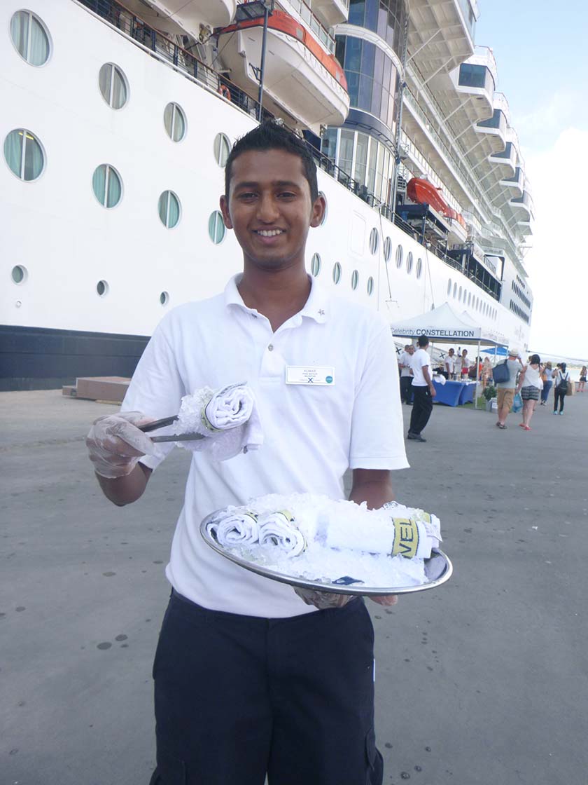 Cruise attendant with cold towel